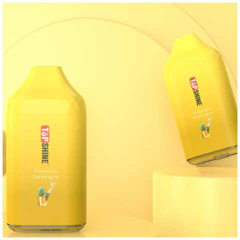 A Pineapple Champagne Top Shine ULTRA Flavor Description Flavor: Pineapple Champagne by Top Shine is a delightful combination of pineapples with a champagne twist. With each puff, you'll experience the sweet and fizzy notes of this mix. This flavor is a perfect balance of smoothness and fruitiness, creating a harmonious blend that will transport you to a tropical paradise. by Vape4Less.