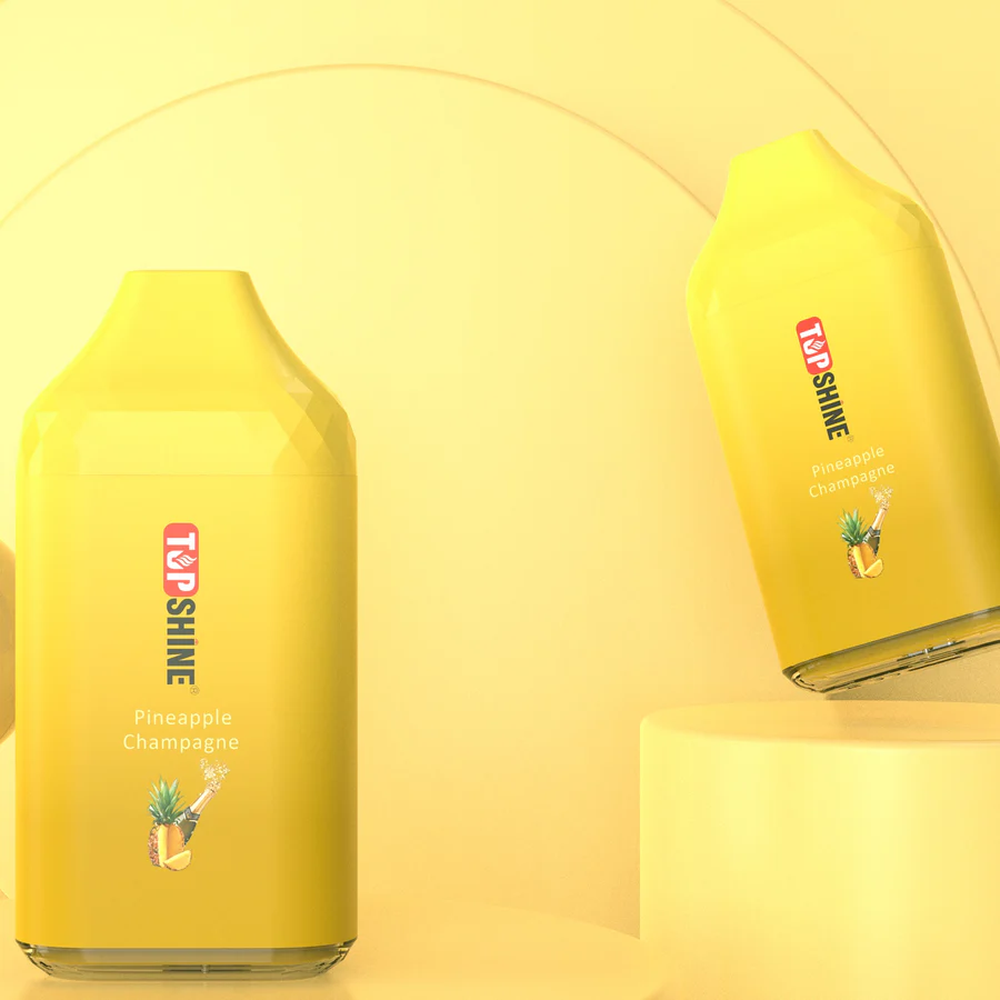 A Pineapple Champagne Top Shine ULTRA Flavor Description Flavor: Pineapple Champagne by Top Shine is a delightful combination of pineapples with a champagne twist. With each puff, you'll experience the sweet and fizzy notes of this mix. This flavor is a perfect balance of smoothness and fruitiness, creating a harmonious blend that will transport you to a tropical paradise. by Vape4Less.